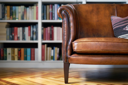 Vintage leather sofa in a classy home library