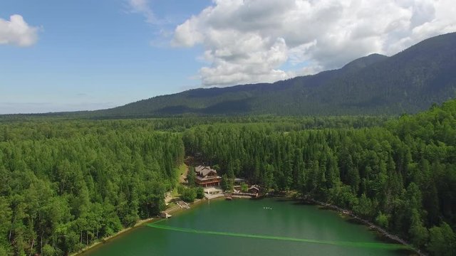 Aerial photography. Heavenly landscape of the landscape with a mountain lake in Siberia near Lake Baikal. Warm lake of the Snezhnaya River. Vydrino