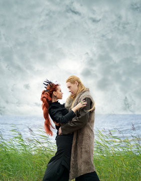 fantasy couple on the beach under the clouds