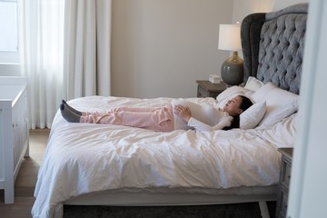 Fototapeta na wymiar Pregnant woman relaxing in bedroom