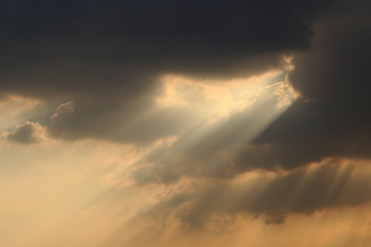sky with clouds and dramatic god light.