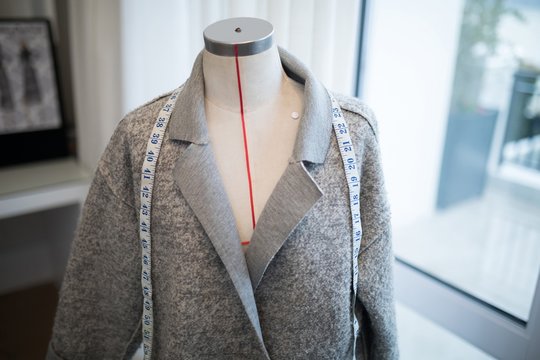 Blazer and measuring tape on mannequin