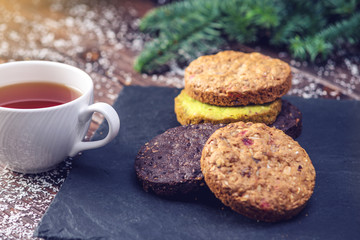 Homemade Christmas or New Year holiday oatmeal cookies with pistachios and chocolate. Concept of festive desserts