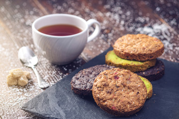 Homemade Christmas or New Year holiday oatmeal cookies with pistachios and chocolate. Concept of festive desserts