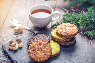 Homemade Christmas or New Year holiday oatmeal cookies with pistachios and chocolate. Concept of festive desserts