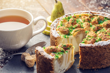 Homemade Christmas or New Year holiday pear pie decorated in a rustic style. Concept of festive desserts