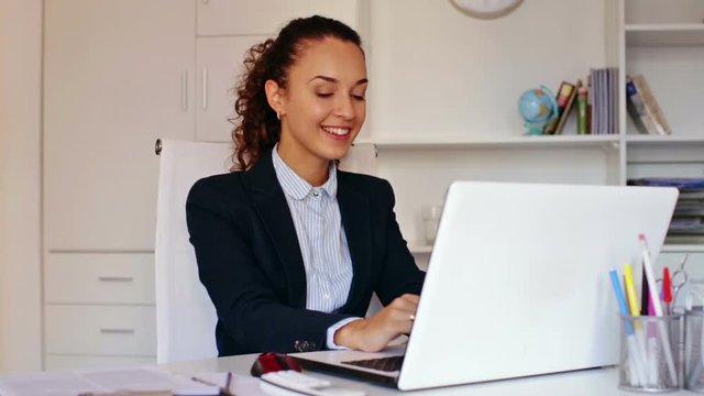 Portrait of successful businesswoman working in modern office