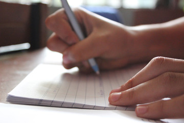Fototapeta premium Student hand writing with a pen. 