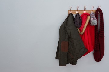 Warm clothing hanging on hook