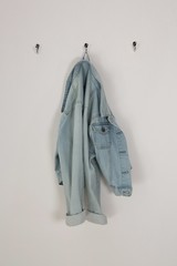 Denim jacket hanging on hook