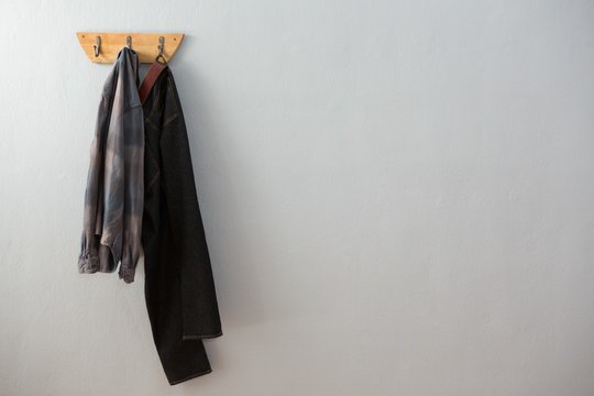 Jeans and shirt hanging on hook