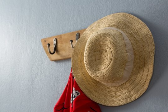 Dress and hat hanging on hook