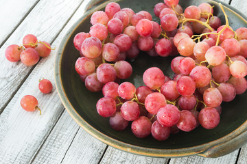 A plate of red grape bunches