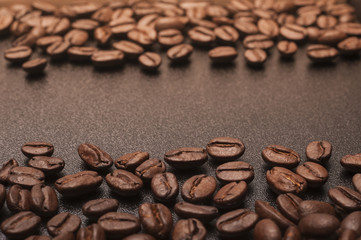 Coffee Beans on a black board background with copy space.