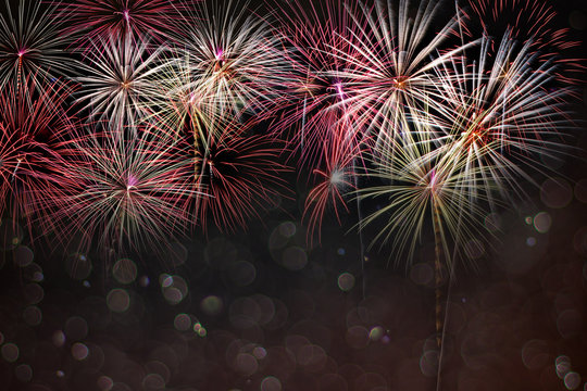 Abstract colored firework background with bokeh in new year festival and free space for text