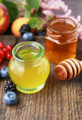 Jar of honey on wooden table