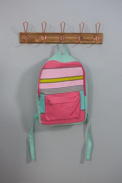Schoolbags hanging on hook