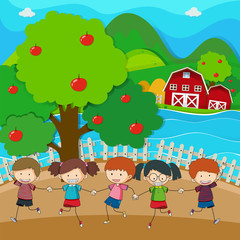 Obraz na płótnie Canvas Happy kids playing in the apple orchard