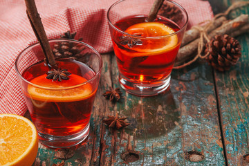 Christmas mulled wine on a rustic wooden table. Holidays concept.
