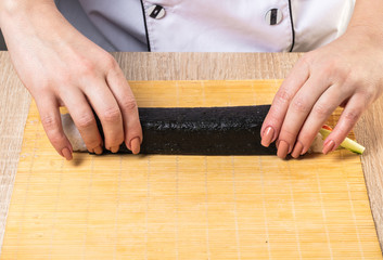 Chef prepares rolls, hands closeup