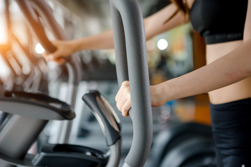 Asian woman exercising in the gym, Young woman workout in fitness for her healthy and office girl lifestyle.