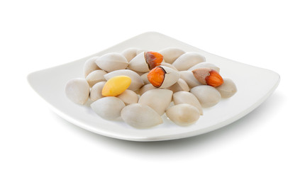 Ginkgo seeds in a plate isolated on white background