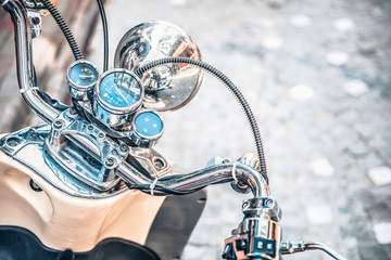 Fototapeta na wymiar Close up of classic motorcycle shinny handlebar speedometer