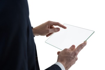 Businessman using glass digital tablet