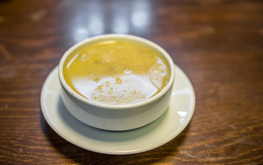 Traditional Turkish hot Tripe Soup on wooden table