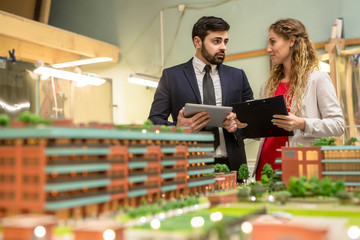 Two urban designers having meeting where discussing new buildings