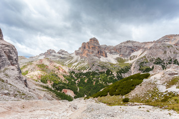 Awesome panorama of Fanis and Lagazuoi Peaks with red rocks at their foots, Travenanzes Valley, Dolomites, Italy