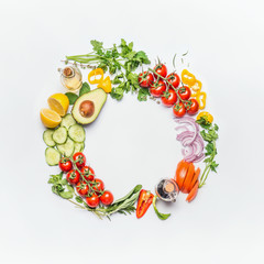 Healthy clean eating layout, vegetarian food and diet nutrition concept. Various fresh vegetables ingredients for salad on white table background, top view, round frame