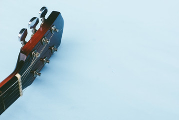 Acoustic Guitar Over Blue Background 