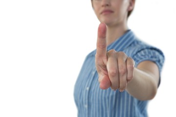Female executive pretending to use an invisible screen
