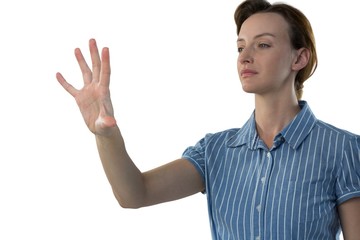 Female executive pretending to use an invisible screen