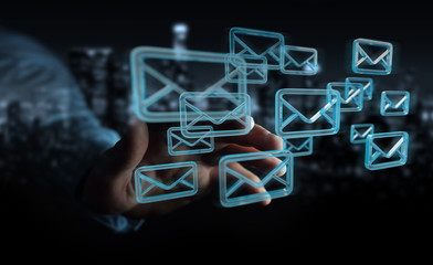 Businessman holding and touching floating emails 3D rendering