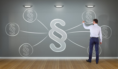 Businessman drawing law paragraph symbol on a wall 3D rendering