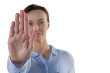 Female executive making stop sign