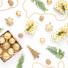 Christmas or new year texture. Christmas decorations in gold colors on white background. Holiday and celebration concept. Top view. Flat lay
