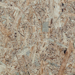 rough surface of the Osb's board with impregnations creates a motley abstract drawing