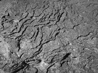 volcanic looking rock formation on the shore