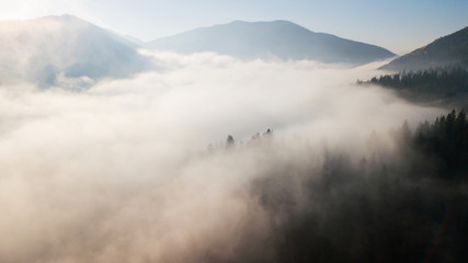 Aerial view of the mountains with a morning fog