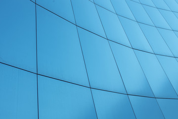 Blue background, business building with the lines on the walls.