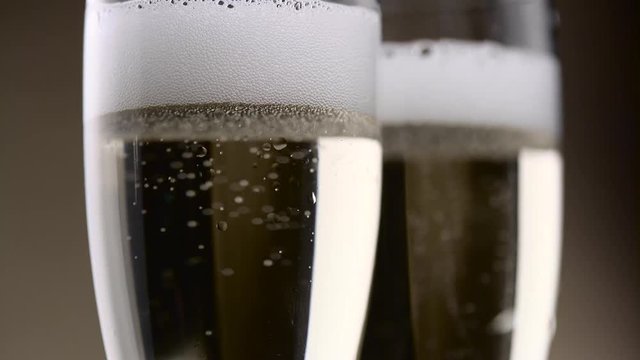 Two goblet of chilled sparkling wine. Close up