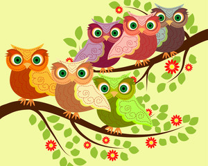 Obraz premium Bright cute cartoon owls sit on the flowering branches of fantastic trees