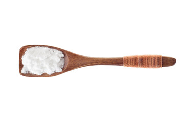 spice salt in  wooden spoon isolated on a white background, top view