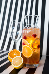 White sangria with citrus fruits and glass  