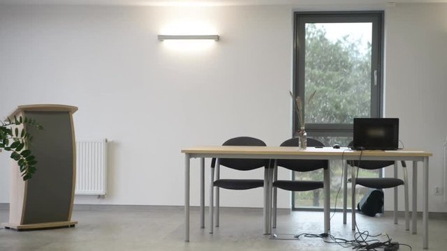 Modern warm office in winter. It is snowing outside.
