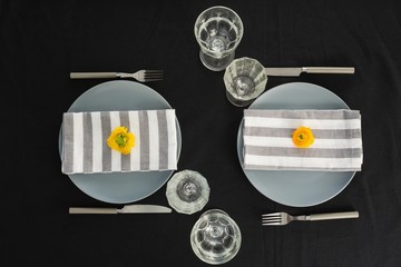 Beautiful table setting with floral arrangement 