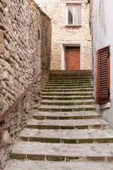 Fototapeta na wymiar Stairs up in Sassocorvaro, a little town of the Montefeltro in the Marche region of Italy